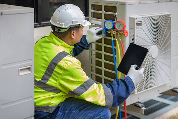 Professional Heat Pump Repair technician working in Springfield, MI